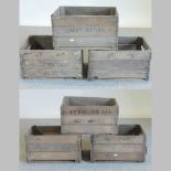 A collection of six vintage wooden apple crates,