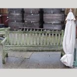 A teak slatted garden bench 183cm,