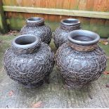 A pair of cane bound garden pots, together with another pair,