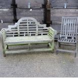 A teak slatted garden bench with scroll arms, 164cm,