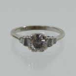 An 18 carat gold single stone diamond ring, approximately 3/4 carat,
