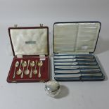 A set of silver handled tea knives, cased,