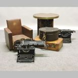 An early 20th century Imperial typewriter, together with another, a brass top table,