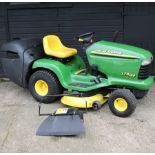 A green John Deere LTR 166 ride on petrol lawn mower