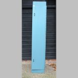 A blue metal gun cabinet,