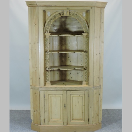 A 19th century pine, barrel back standing corner cabinet,