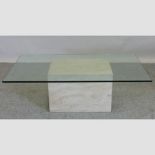 A Dansk travertine marble and glass coffee table,