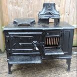 A black painted cast iron stove,