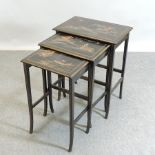 A nest of three 1920's black japanned and gilt chinoiserie decorated occasional tables,