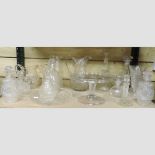 A shelf of mainly 19th century glassware, to include a tazza and decanters,