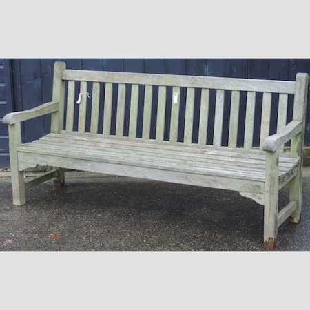 A teak slatted garden bench,