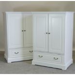 A modern white wardrobe, of small proportions, together with another,