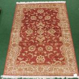 A Ziegler carpet, on a red ground,