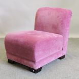 A modern pink upholstered chair