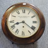 An early 20th century oak cased wall clock, the painted dial inscribed Thurlow Champness & Son,