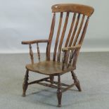 A Victorian elm splat back armchair