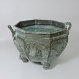 A Chinese bronze jardiniere, with relief decoration,