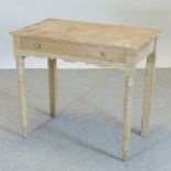 An antique pine side table, on turned legs,