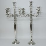 A pair of large chrome four branch candelabra,