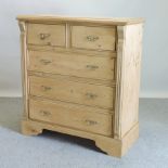 A continental style pine chest of drawers,