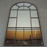 A large metal framed sectional wall mirror,