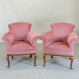 A pair of 1920's pink upholstered armchairs,