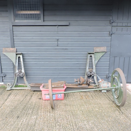 A lathe by Thompson Houston, on a metal stand with accessories,