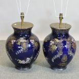 A pair of early 20th century French blue glazed pottery table lamps,