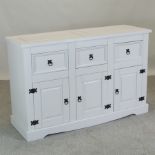 A modern cream painted pine sideboard,