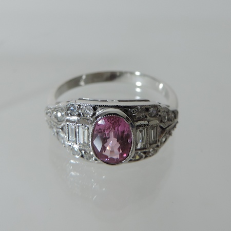 An 18 carat white gold pink sapphire and diamond cluster ring