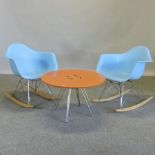 A pair of moulded blue plastic rocking chairs,