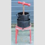 A painted cast iron cider press,