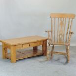 A modern beech splat back rocking chair, together with a pine coffee table,