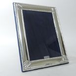 A contemporary silver photograph frame,