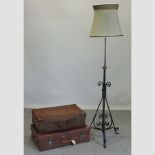 A black wrought iron standard lamp and shade, together with two vintage suitcases,