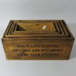 A set of five wooden graduated advertising boxes,