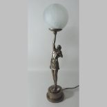 An Art Deco style figural table lamp, with an opaque white glass shade,