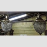 A pair of gilt metal and cut glass chandeliers,