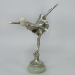 An Art Deco style figure of a lady ice skating,