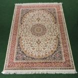 A Keshan rug, on a cream ground,