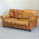 A modern brown leather upholstered two seater sofa,