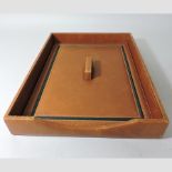 An Asprey brown leather desk tidy,