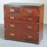 A 19th century stained pine and brass bound military style chest,