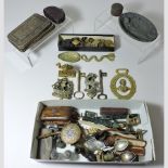 A collection of items to include an embossed metal plaque, 14cm tall, a set of brass buttons,