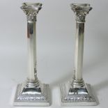 A pair of silver candlesticks, in the form of corinthian columns, London 1944,