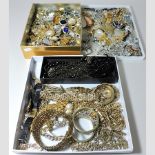 Three boxes of costume jewellery, to include Butler and Wilson and other brooches,