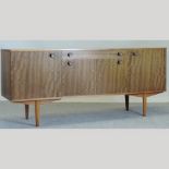 A 1970's teak sideboard, bearing a label for Grange, Morris of Glasgow,