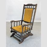 A 19th century gold upholstered American rocking chair