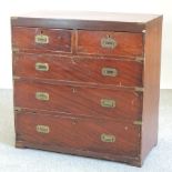 A 19th century stained pine and brass bound military style chest of drawers,