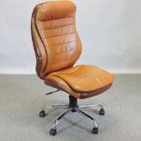 A brown leather upholstered office swivel chair,